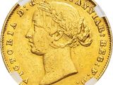 a close up of a gold coin on a white background