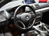 a car dashboard with a steering wheel and dashboard controls