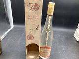 a bottle of wine that is next to a bottle of wine