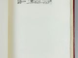 an open book with a drawing of a cat on it