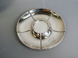 a silver plate with a flower design on it