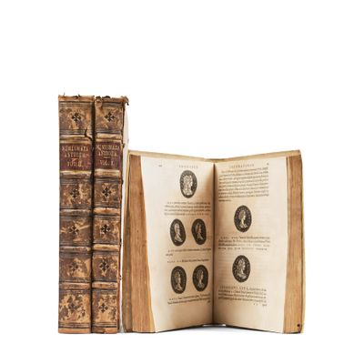 an old book opened to show a series of books with portraits on them