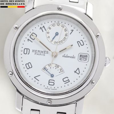 a close up of a wrist watch with a white dial