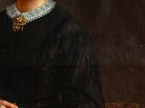 portrait of a woman in a black dress holding a cigarette