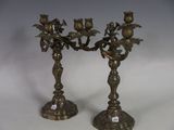 pair of antique brass candlesticks with birds and flowers on them