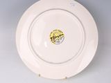 an image of a white plate with a picture of a man on it
