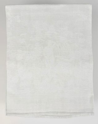 a white linen napkin with a floral design on it