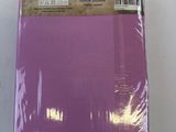 a close up of a package of purple paper on a white surface