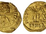 une pièce d'or portant l'image d'une femme et d'un homme