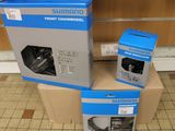 two boxes of shimano front chainwheels and a box of shimano front chainwheels