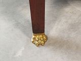 a close up of the legs of a wooden table
