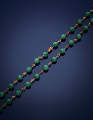 a gold and jade bead necklace, by person