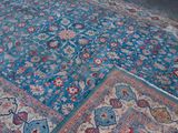 a large oriental rug on the floor in the room