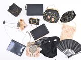 a lot of purses that are sitting on a table