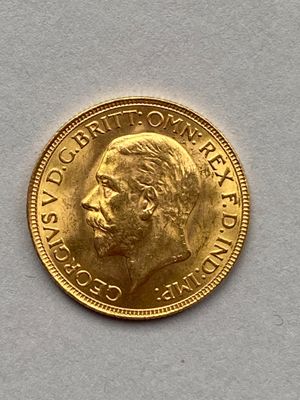 l'image d'une pièce d'or sur laquelle figure le visage d'un homme