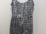 a black and white dress hanging on a hanger