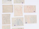 une image représentant un ensemble de dessins sur papier posés sur une surface blanche