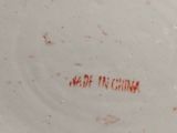 a white plate with a red writing on it