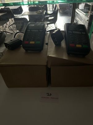 two phones sitting on top of a box in a room