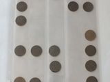 a lot of coins in a plastic bag on the table