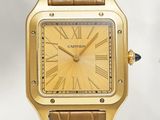 a close up of a gold watch with roman numerals on the face