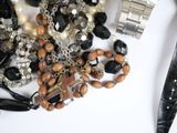 a lot of jewelry and a knife on the table