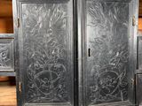 a black cabinet that has a bunch of drawers inside of it