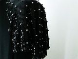 an image of a woman wearing a black jacket