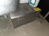 a metal box that has a container on top of it