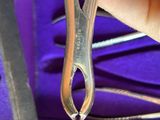 a person holding a pair of scissors in their hand