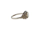 a close up of a ring with a stone in it