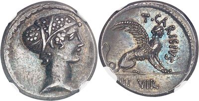 a close up of a coin with a bird on it