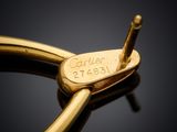 an image of a close up of a gold ring with a tag on it