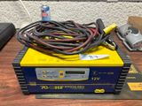 a yellow and black box with wires on top of it