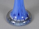 a blue glass vase with a star design on it