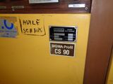 a sign on the door of a yellow machine