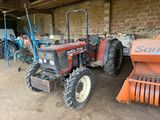 a tractor that is parked in a garage