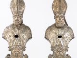 pair of silver metal busts of a pope and a cardinal