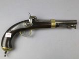an old gun that is on display on a table