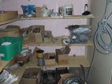 a room with a lot of boxes and boxes on the shelves