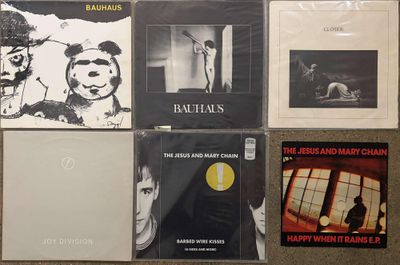a lot of cds on the floor with pictures on them