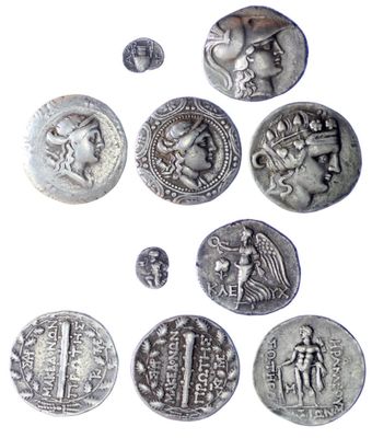 an image of a group of silver coins with a picture of a man and a woman on them