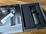 a box with a razor and a razor blade in it on a table