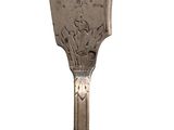 a silver spoon with a handle that has a design on it