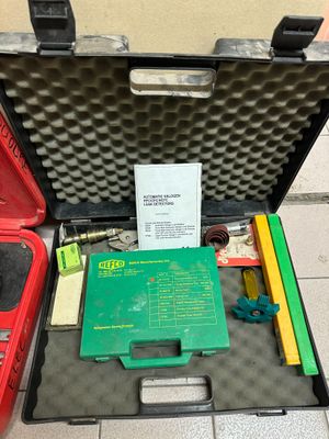 a case with tools in it sitting on the floor