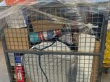 a cage with a goat inside of it in a warehouse