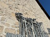 a lot of pipes attached to the side of a building
