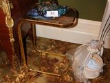 a blue fish sitting on top of a table next to a chair