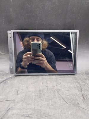 a man taking a picture of himself in a mirror