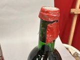two bottles of wine that are sitting on a table